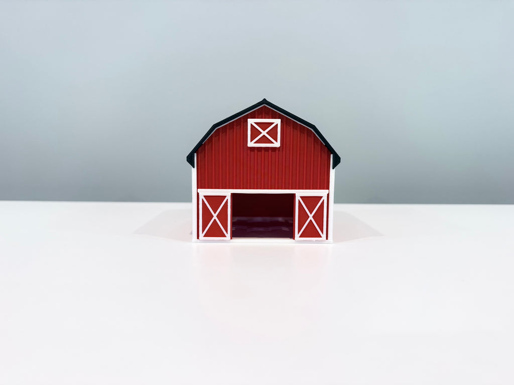 Front view of the red Barn miniature with white door trim and an open doorway.