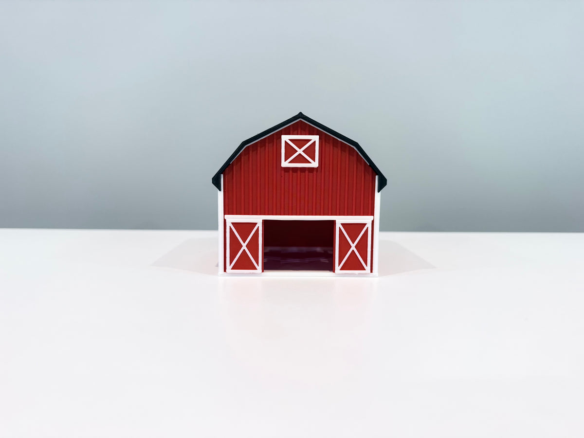 Front view of the red Barn miniature with white door trim and an open doorway.