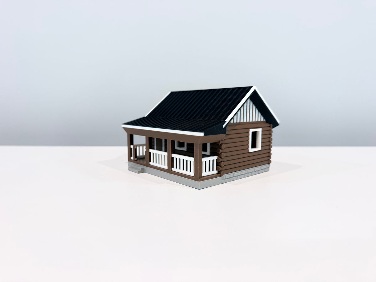 Opposite angled view of the Cabin miniature showing the porch and side wall.