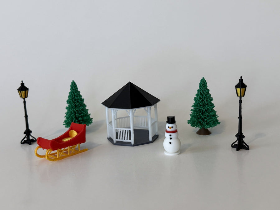 Primrose 4D Village Square seven-piece Christmas village accessory set