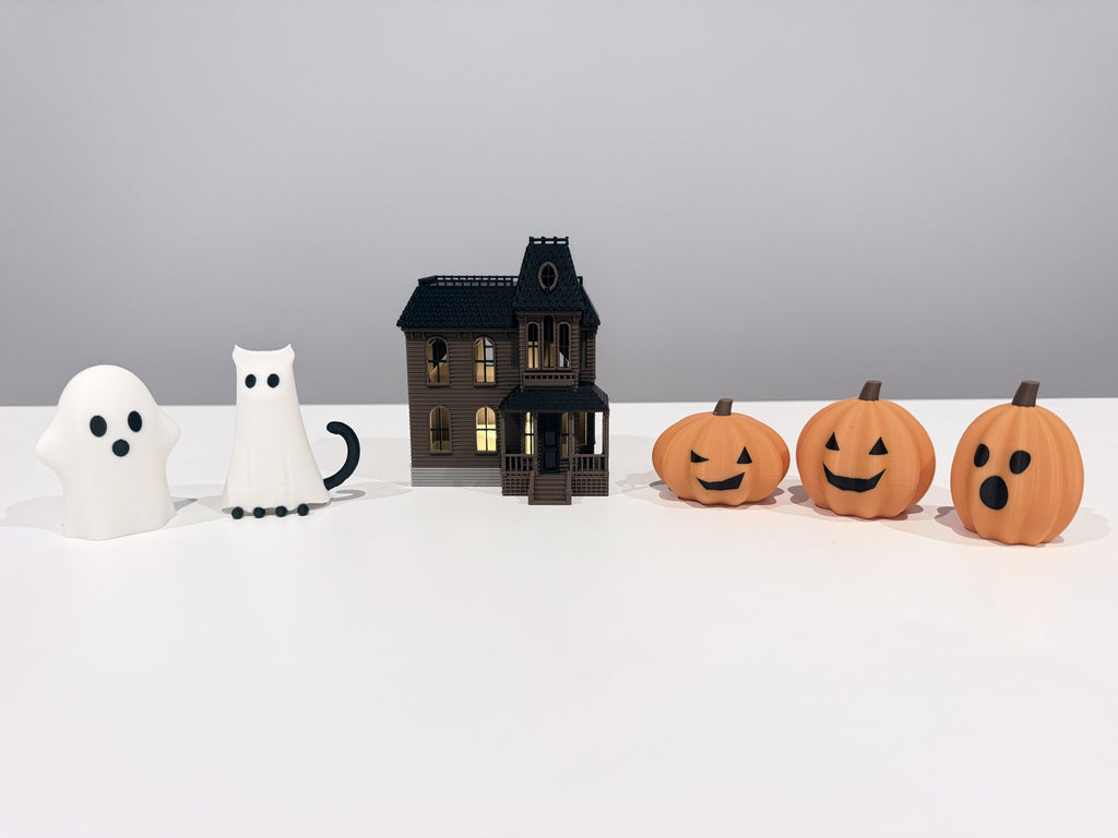 Spooky Hollow six-piece Halloween set with ghost, cat in ghost costume, spooky house and three jack-o'-lanterns